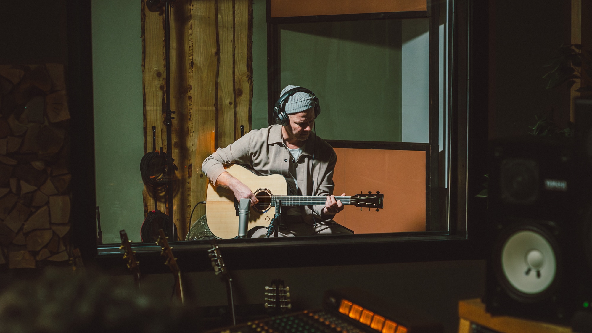 Artist recording in a studio with the TAG3 C acoustic guitar.