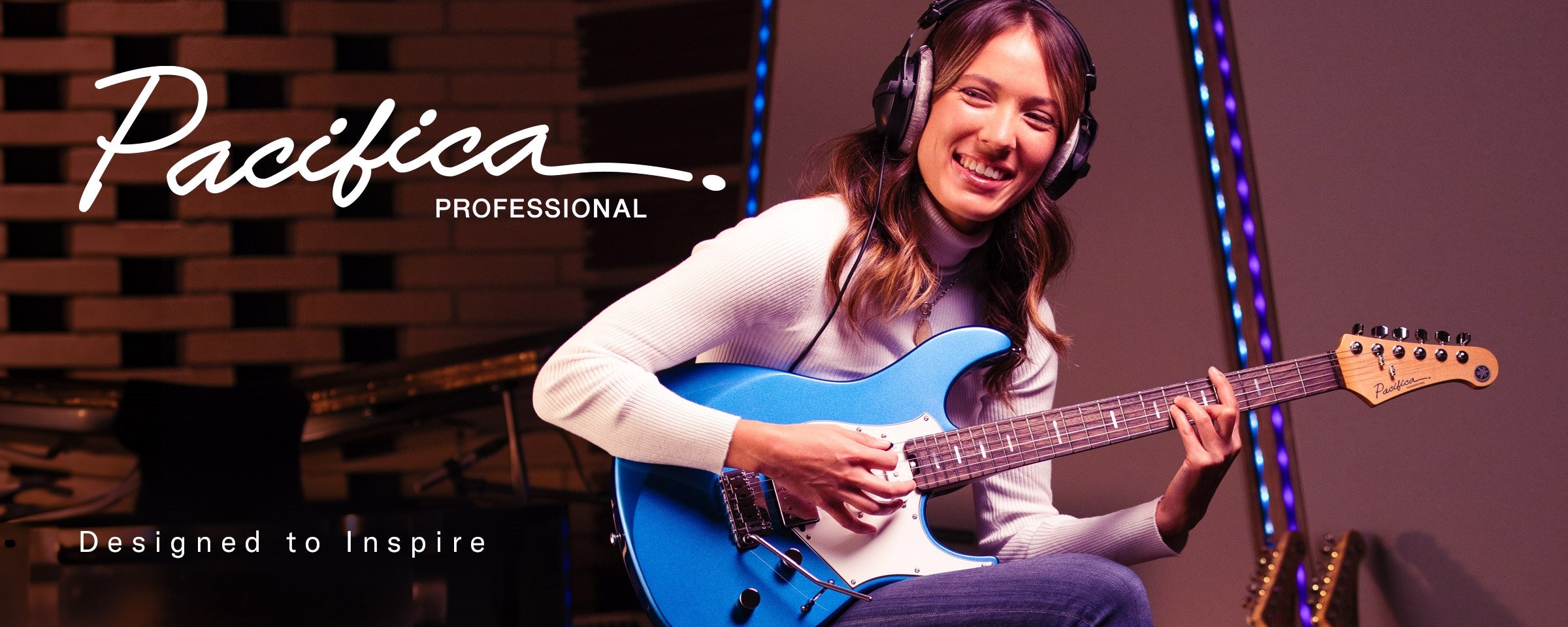 Pacifica professional logo & designed to inspire text. Female on stage performing with Sparkle Blue.